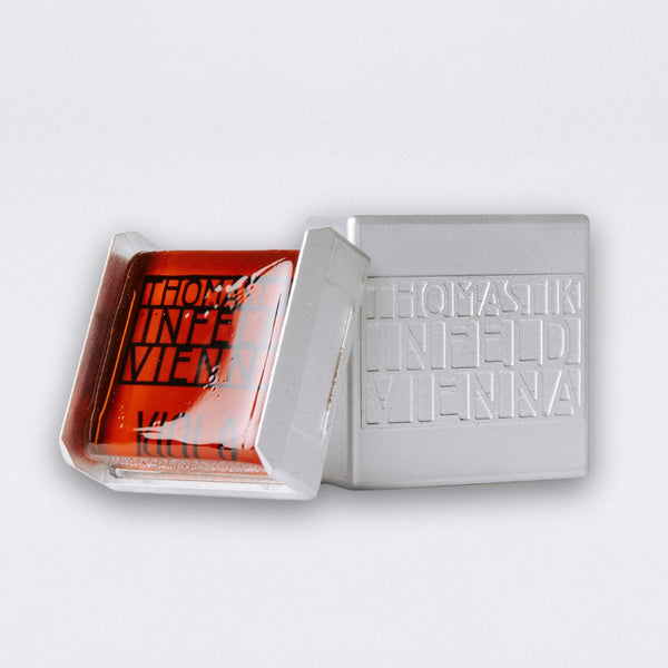 Thomastik-Infeld TI vioa rosin TIVA01 showing open magnetic case with rosin